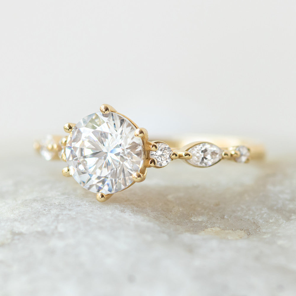 Coco yellow gold side stone engagement ring