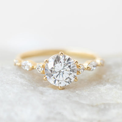 Coco side stone engagement ring