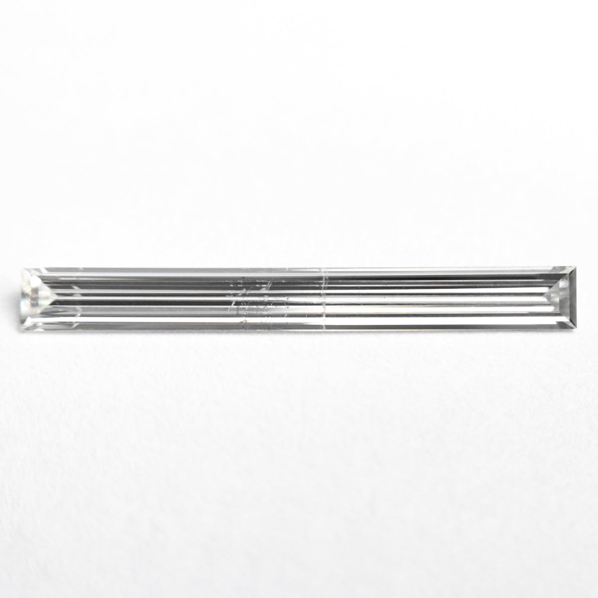 0.52ct 19.44x2.17x1.09mm SI2 E Baguette Step Cut 26545-01