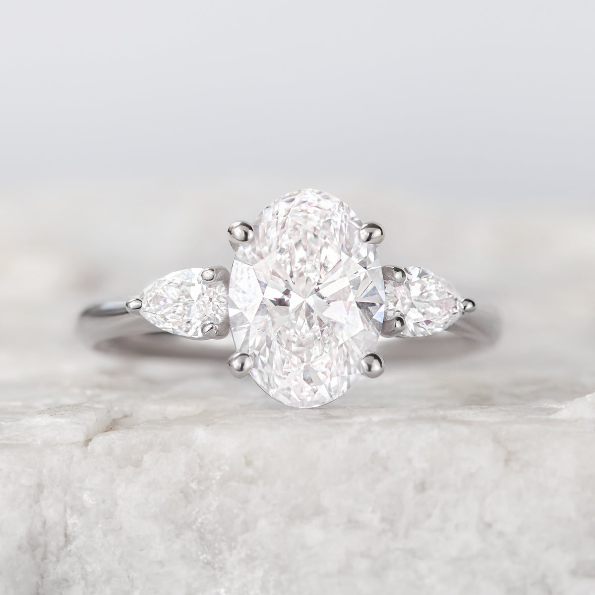 Mae ~ Pear Three Stone Ring
