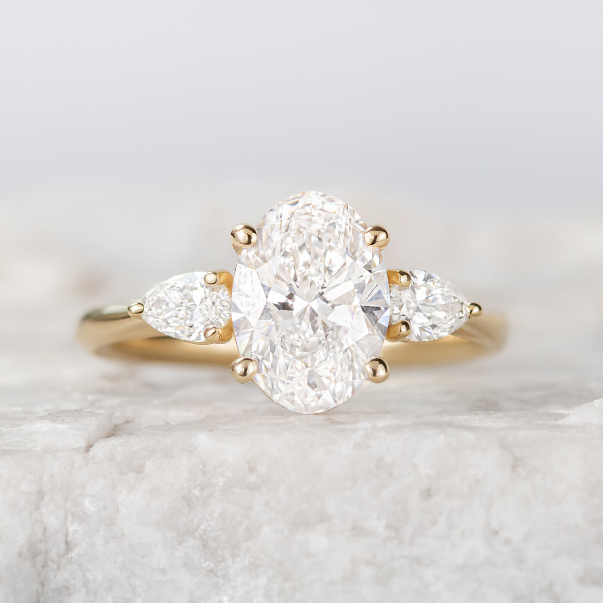 Mae ~ Pear Three Stone Ring