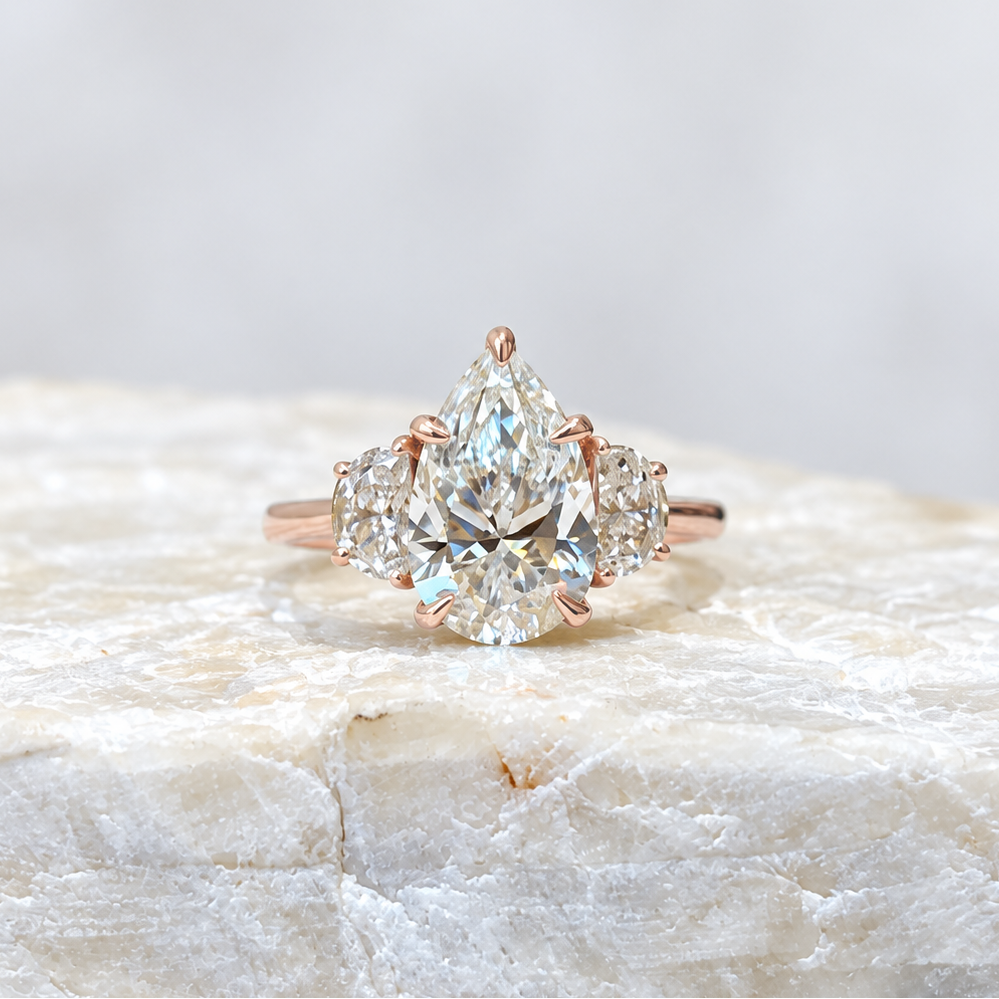 Mary ~ Pear Cut Half-Moon Three Stone Ring