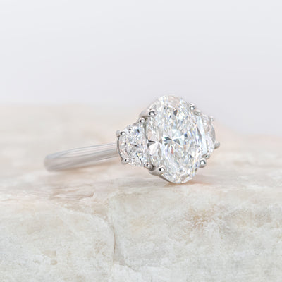 Platinum Oval Diamond Ring with Half-Moon Side Stones