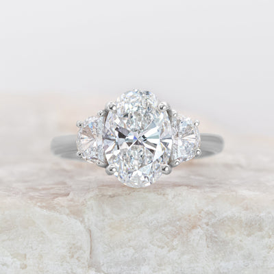 Platinum Oval Diamond Ring with Half-Moon Side Stones