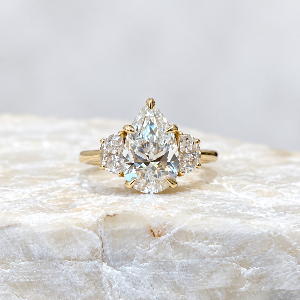 Mary ~ Pear Cut Half-Moon Three Stone Ring