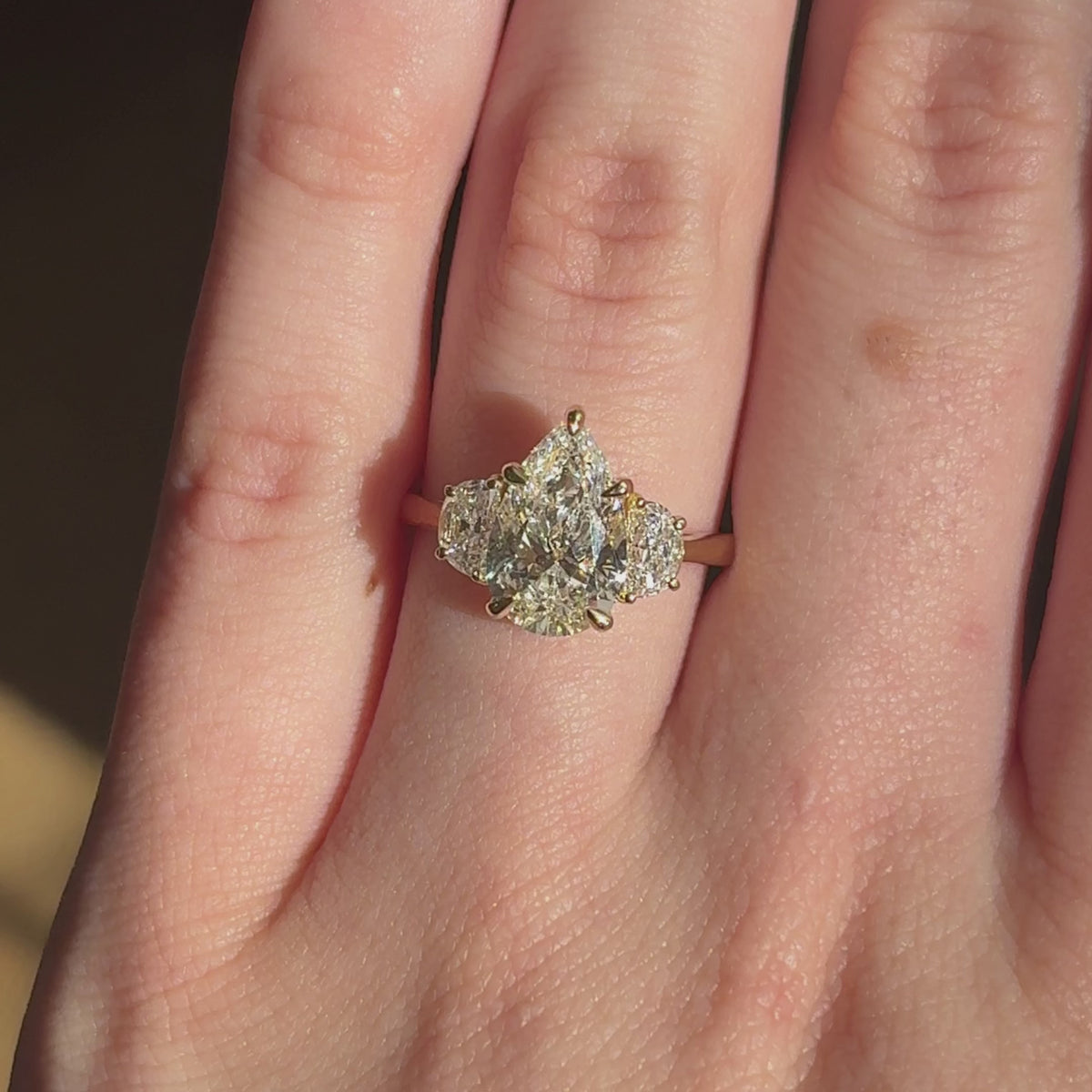 Mary ~ Pear Cut Half-Moon Three Stone Ring