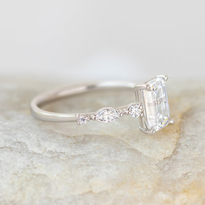 Coco emerald cut side stone engagement ring