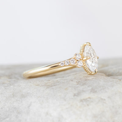 Yellow gold side stone engagement ring