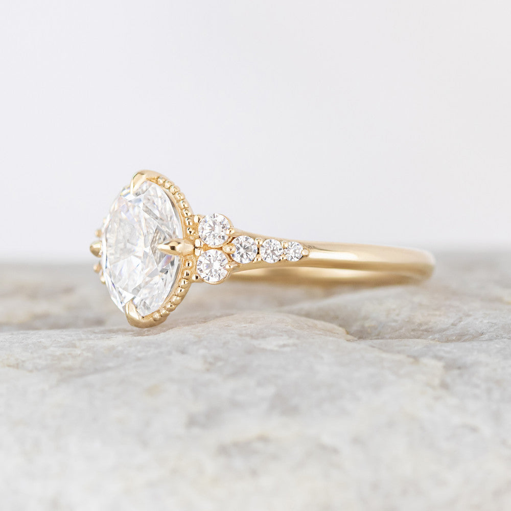 Yellow gold side stone engagement ring